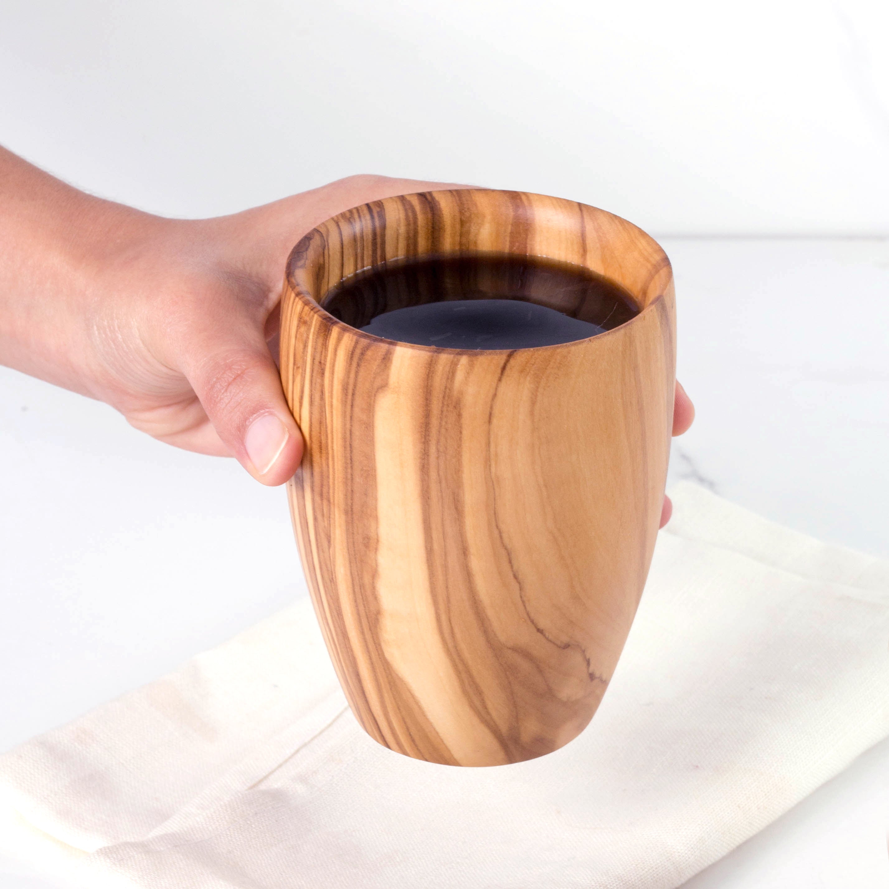Handmade Large Olive Wood Cup: Enjoy the rustic elegance of this eco-friendly cup for your morning coffee or evening tea. Durable and naturally insulating, it's a unique addition to your drinkware collection.